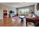 Inviting living room with stylish decor and hardwood flooring at 9622 Harvest Pond Nw Dr, Concord, NC 28027
