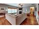 Comfortable living room with hardwood floors, a fireplace, and plenty of natural light at 9622 Harvest Pond Nw Dr, Concord, NC 28027
