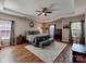 Spacious main bedroom with tray ceilings and hardwood floors at 9622 Harvest Pond Nw Dr, Concord, NC 28027