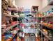Walk-in pantry with organized shelving and ample storage space for food and household items at 9622 Harvest Pond Nw Dr, Concord, NC 28027