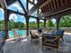 Relaxing community poolside patio offering comfortable seating and scenic views at 9622 Harvest Pond Nw Dr, Concord, NC 28027