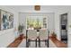 Cozy dining room with a bay window and wood floors at 9637 Stoney Hill Ln, Charlotte, NC 28277