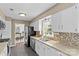 Modern kitchen with stainless steel appliances, granite countertops, and tile backsplash at 9637 Stoney Hill Ln, Charlotte, NC 28277