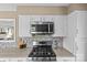 Updated kitchen featuring stainless steel appliances and a modern gas cooktop at 9637 Stoney Hill Ln, Charlotte, NC 28277