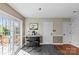 Kitchenette area with a breakfast bar, seating for two, and sliding glass door at 9637 Stoney Hill Ln, Charlotte, NC 28277