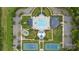 Aerial view of community pool, clubhouse, tennis courts, and playground surrounded by lush landscaping at 1117 Cedar Park Dr, Pineville, NC 28134