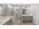 Modern bathroom featuring glass enclosed shower and dual vanities at 1117 Cedar Park Dr, Pineville, NC 28134
