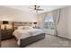 Bedroom with ceiling fan, neutral wallpaper, and bright windows at 1117 Cedar Park Dr, Pineville, NC 28134