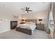 Spacious bedroom featuring modern furniture and natural light from a window at 1117 Cedar Park Dr, Pineville, NC 28134