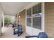 Welcoming front porch with rocking chairs and plants, perfect for relaxing outdoors at 1117 Cedar Park Dr, Pineville, NC 28134