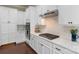 Modern kitchen showcasing white cabinetry, stainless steel appliances, and a marble countertop at 1117 Cedar Park Dr, Pineville, NC 28134