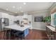 Bright and airy kitchen featuring white cabinetry, stainless steel appliances, and a large island at 1117 Cedar Park Dr, Pineville, NC 28134