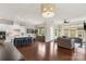 Open concept kitchen and living room featuring hardwood floors at 1117 Cedar Park Dr, Pineville, NC 28134