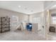 Cozy upstairs loft area featuring bright windows and a blue armchair at 1117 Cedar Park Dr, Pineville, NC 28134