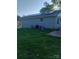 Backyard view of home featuring a grassy area and solar panels on the roof at 1204 Borders Rd, Shelby, NC 28150