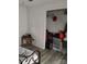 Bedroom showing a bed, side table, and a walk-in closet with shelving and stored items at 1204 Borders Rd, Shelby, NC 28150