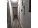 Hallway featuring new flooring, fresh paint, and updated fixtures, seamlessly connecting living spaces at 1204 Borders Rd, Shelby, NC 28150