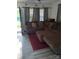 Inviting living room featuring a large sectional sofa and laminate floors throughout at 1204 Borders Rd, Shelby, NC 28150