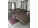 Comfortable living room with a large sectional sofa, neutral tones, and laminate floors throughout at 1204 Borders Rd, Shelby, NC 28150