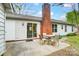 Patio with seating area and view of the house featuring a brick chimney at 1212 Robinhood Cir, Charlotte, NC 28227