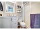 Bright bathroom featuring a vanity with white cabinets and a framed mirror, plus a shower stall at 1212 Robinhood Cir, Charlotte, NC 28227