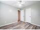 Bedroom featuring a ceiling fan, and wood-look laminate flooring at 1212 Robinhood Cir, Charlotte, NC 28227