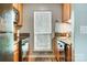 Well-lit kitchen with stainless steel appliances, tile countertops, and a window with natural light at 1212 Robinhood Cir, Charlotte, NC 28227