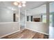 Spacious living room with wood floors, neutral paint, and brick fireplace creating a cozy ambiance at 1212 Robinhood Cir, Charlotte, NC 28227
