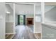 Living room with a brick fireplace, large window, modern flooring, and neutral colors at 1212 Robinhood Cir, Charlotte, NC 28227