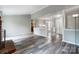 Open-concept living space with modern flooring, open floorplan, and a partial view of the kitchen at 1212 Robinhood Cir, Charlotte, NC 28227