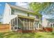 Outdoor shot of the back of the house featuring a screened in porch at 14130 Misty Brook Ln, Charlotte, NC 28273