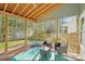Interior view of screened-in porch featuring outdoor furniture and a view of the backyard at 14130 Misty Brook Ln, Charlotte, NC 28273