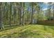 Picture of the backyard featuring a wooden fence and plenty of trees at 14130 Misty Brook Ln, Charlotte, NC 28273