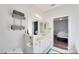 Well-lit bathroom with double sinks, white cabinets, and stylish towel rack at 14130 Misty Brook Ln, Charlotte, NC 28273