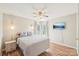 Comfortable bedroom featuring wood floors, a ceiling fan, and a wall-mounted television at 14130 Misty Brook Ln, Charlotte, NC 28273