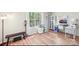 Bright and airy bonus room with an abundance of natural light and wood-look floors at 14130 Misty Brook Ln, Charlotte, NC 28273