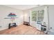 This is a bright bonus room with an abundance of natural light and wood-look floors at 14130 Misty Brook Ln, Charlotte, NC 28273