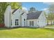 Charming home with blue siding, well-manicured lawn and attached two car garage at 14130 Misty Brook Ln, Charlotte, NC 28273