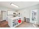 Bright kitchen features an island, tile flooring, modern appliances, and ample storage space at 14130 Misty Brook Ln, Charlotte, NC 28273