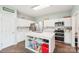 Bright kitchen featuring stainless steel appliances, white cabinets, a large island with seating at 14130 Misty Brook Ln, Charlotte, NC 28273