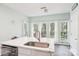 Bright and airy kitchen featuring stainless steel appliances, white cabinets and a large island at 14130 Misty Brook Ln, Charlotte, NC 28273