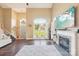 This is a spacious living room with a fireplace, hardwood floors and plenty of natural light at 14130 Misty Brook Ln, Charlotte, NC 28273