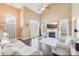 Spacious living room with vaulted ceilings, a fireplace, and large windows providing plenty of light at 14130 Misty Brook Ln, Charlotte, NC 28273