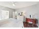 Spacious main bedroom with natural light, ceiling fan, ensuite bathroom and wood-look floors at 14130 Misty Brook Ln, Charlotte, NC 28273