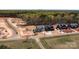 Aerial view of new homes in a residential area with trees and roadways near construction at 143 Mills Garden Rd, Statesville, NC 28625