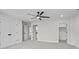Cozy bedroom with neutral carpeting, ceiling fan, ensuite bathroom, and walk-in closet at 143 Mills Garden Rd, Statesville, NC 28625