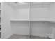 Walk-in closet with carpet and white shelving, offering ample storage space at 143 Mills Garden Rd, Statesville, NC 28625