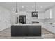 Modern kitchen featuring a large island, stainless steel appliances, subway tile backsplash, and stylish pendant lighting at 143 Mills Garden Rd, Statesville, NC 28625