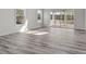 Bright living room featuring light wood floors, plenty of natural light and sliding glass door to patio at 143 Mills Garden Rd, Statesville, NC 28625