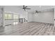 Spacious loft area with wood floors, ceiling fans, and views of the home's lower level at 143 Mills Garden Rd, Statesville, NC 28625